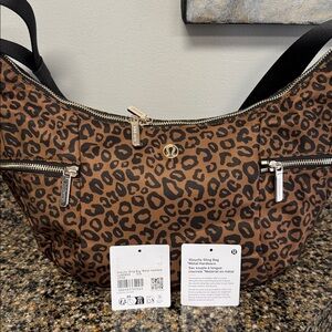 NWT Lululemon slouchy sling bag 6L Leopard print